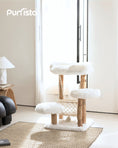Load image into Gallery viewer, Purrista white three-layer wooden cat tree with fluffy platforms, rope hammock, and natural wood posts, displayed in a sunlit minimalist living room